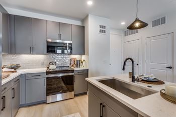 Gourmet prep islands with pendant lighting*